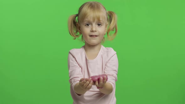 Kid Playing with Hand Made Toy Slime, Child Having Fun Making Pink Slime