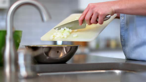 Man preparing food in kitchen at home 4k