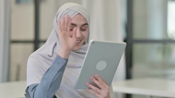 Video Call on Tablet By Young Arab Woman