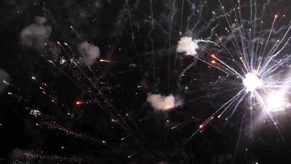 Bright Fireworks of Different Colors Exploding in the Air at Night in the Skies