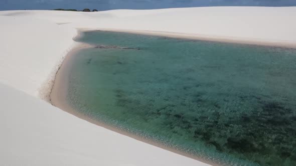Crystal Clear Blue Rain Water Lagoons in Dunes of Lencois Maranhenses.