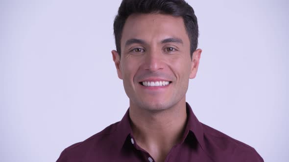 Face of Young Happy Hispanic Businessman Smiling