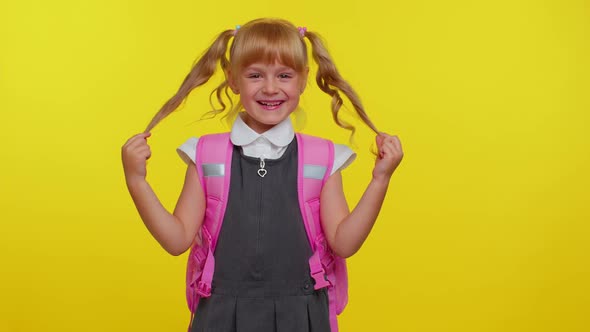 Happy Girl Kid in School Uniform Play with Pony Tails Laugh Fooling Around Making Playful Silly Face