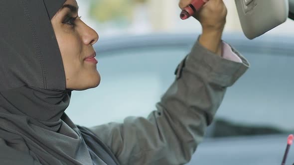 Muslim Woman Doing Makeup in Car While Stuck in Traffic Jam, Risk of Accident