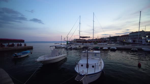 A 180’ view of the marina in Sumartin Brac Island Croatia with the sunset