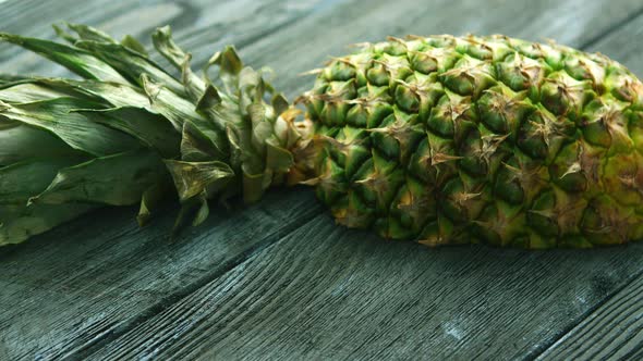 Half of Pineapple on Wooden Table