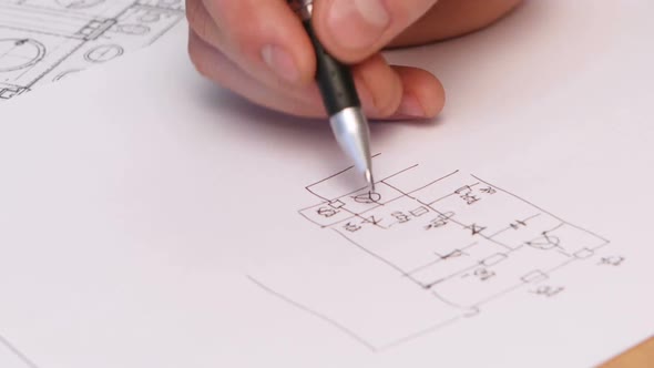 Person's Hand Drawing Plan On Blue Print. TimeLapse