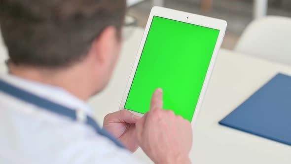 Middle Aged Male Doctor Using Tablet with Chroma Screen