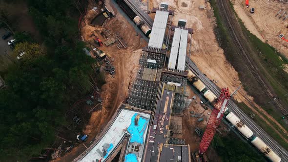 Cistern Train Moving By New Bridge Construction Site Revealing Aerial Shot