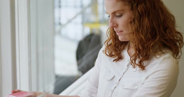 Businesswoman busy selecting color shades out of color palate 4k