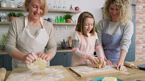 Video of girl have fun during making dough with family. Shot with RED helium camera in 8K.