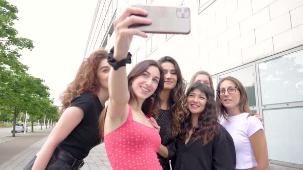 Slow motion shot of happy group of best friends taking a selfie