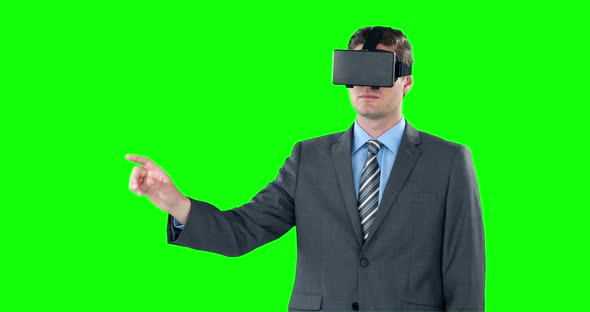 Happy businessman using virtual reality headset