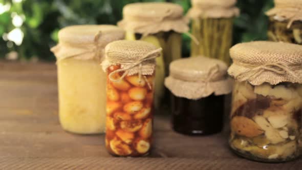 Homemade canned organic vegetables in glass jars.