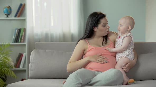 Young Lady Expecting Child, Enjoying Time With Little Baby, Happy Motherhood