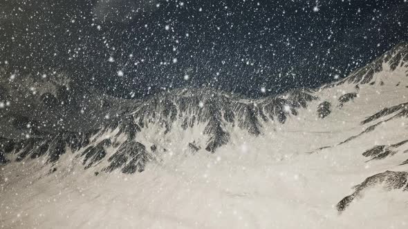 Heavy Snowing Focused on the Snowflakes Mountains in the Background