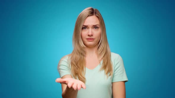 Displeased Young Woman Covering Eyes and Gesturing Stop Against Blue Background