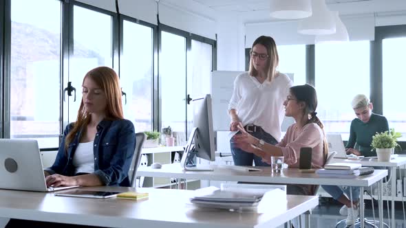 Slow motion shot of businesswomen working at the office