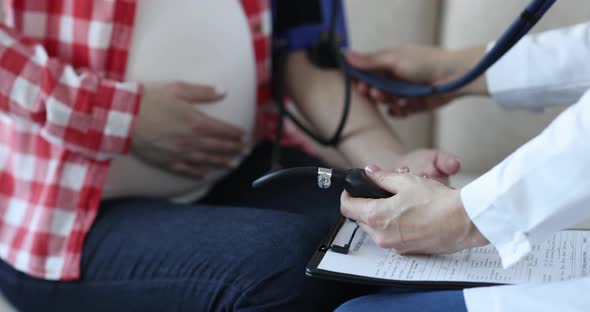 Doctor Measuring Blood Pressure of Pregnant Woman Closeup  Movie