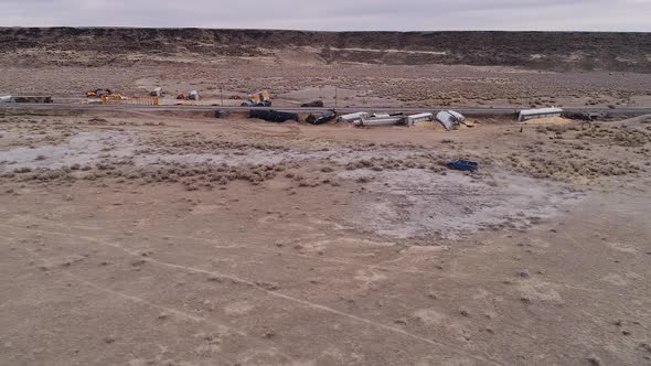 Truck driving through field toward train crash in the Utah desert