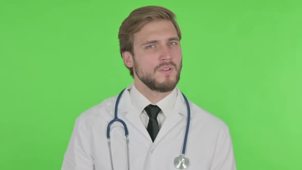 Denying Young Doctor in Rejection on Green Background