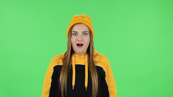 Portrait of Modern Frustrated Girl in Yellow Hat with Shocked Wow Face Expression