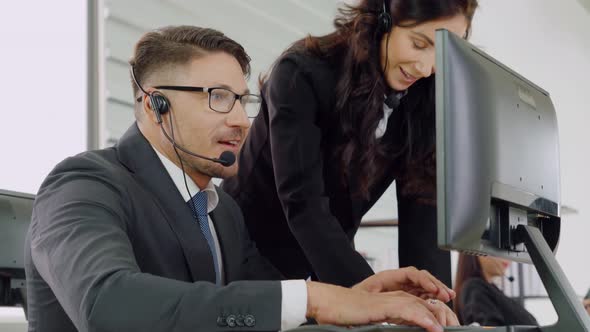 Business People Wearing Headset Working in Office