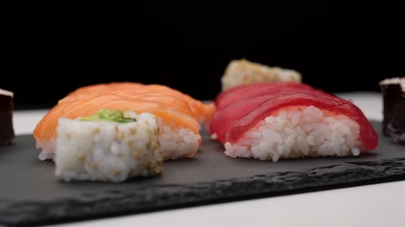 Sushi assortment Asian Japanese food with nigiri salmon, nigiri tuna, hosomaki, uramaki