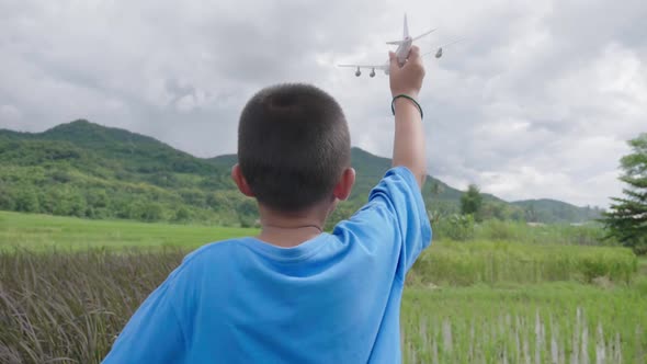 Boy Flying A Airplane