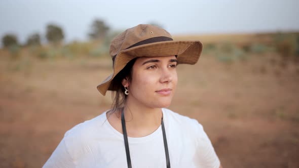 Woman standing in desert field