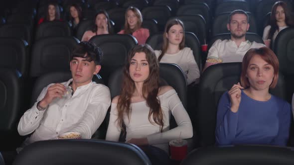 Tensed Audience Watching Horror Film Cinema