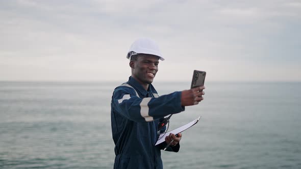 Bosun or Seaman Officer is Taking Selfie on the Mobile Cell Phone