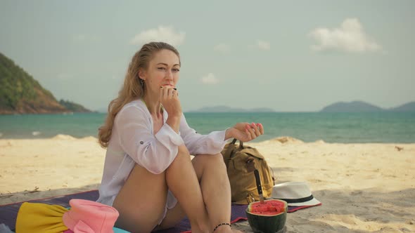 The Cheerful Woman in Holding and Eating Slices of Watermelon on Tropical Sand Beach Sea. Portrait