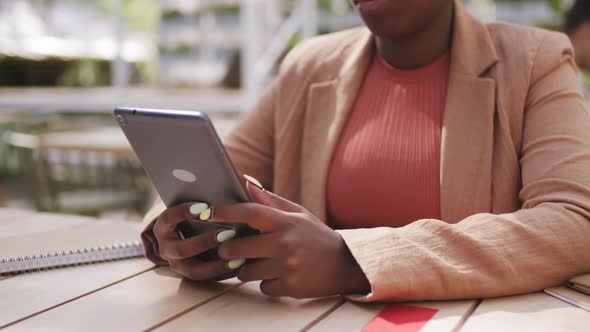  Unrecognizable Black Woman Using Tablet