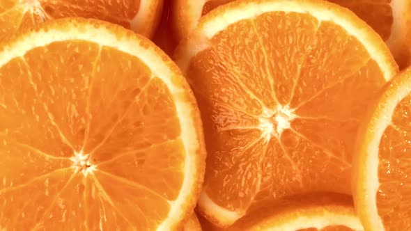 Heap Fresh Summer Orange Circle Slice Pulp Texture with Peel Top View Tracking Macro Shot