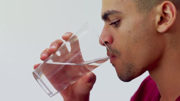 Close-up of executive drinking water