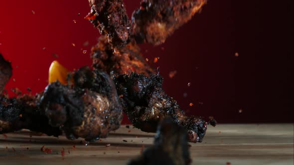 Smoked chicken wings falling and bouncing in ultra slow motion 1500fps - CHICKEN WINGS PHANTOM 035