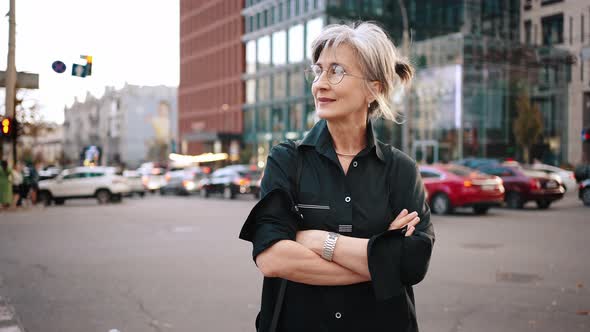 Mature Confident Business Lady in the Middle of the City Street