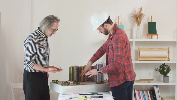 Senior Architect Monitoring Trainee's Work