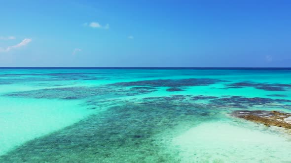 Aerial seascape of paradise coastline beach holiday by blue ocean with white sandy background of a d