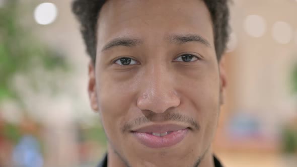 Close Up of Face of African American Man Smiling at the Camera