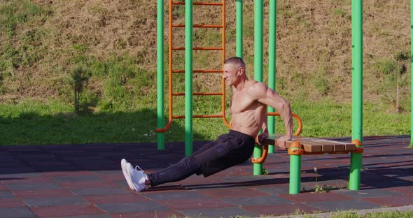 Sporty Shirtless Man Doing Push Ups Outdoors