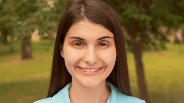 Close Up Face Young Woman Use Headphones Outdoors