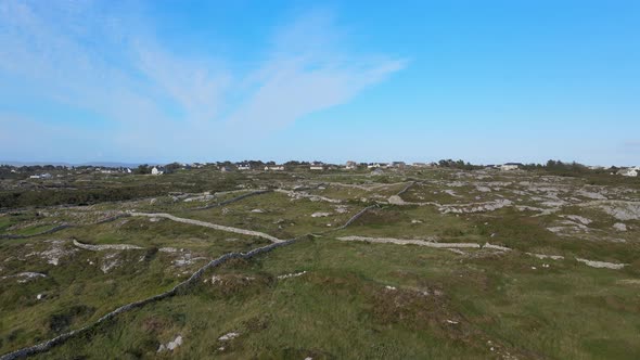 Farmers Houses In Connemara Near Coral Strand Beach With Fields Divided By Walls Made From Rocks Und