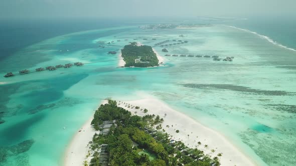 Aerial Drone View of a Beautiful Atoll or Island with a Resort in the Maldives