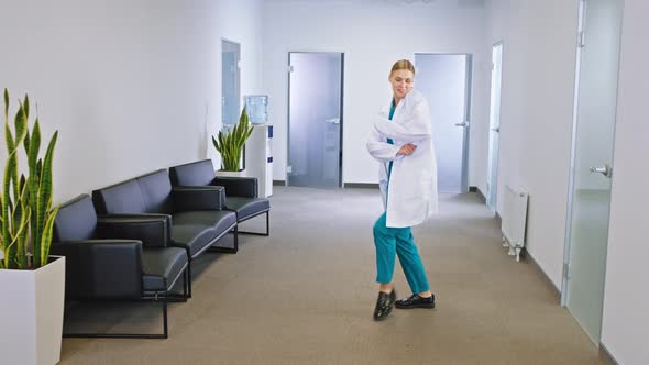 In Front of the Camera Pretty Lady Doctor in a