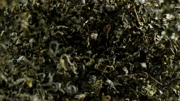 Super Slow Motion Shot of Dried Green Tea Explosion Isolated on Black Background at 1000Fps