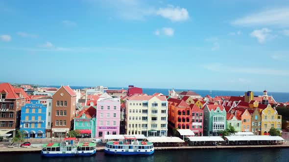 Tilt down aerial view of the skyline of the Punda district in Willemstad, Dutch Caribbean island. St