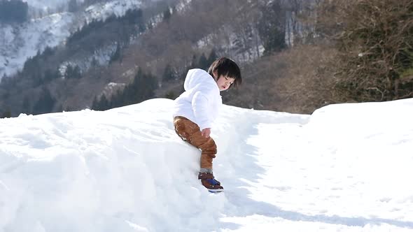 Cute Asian Child Playing Snow Outdoors Slow Motion