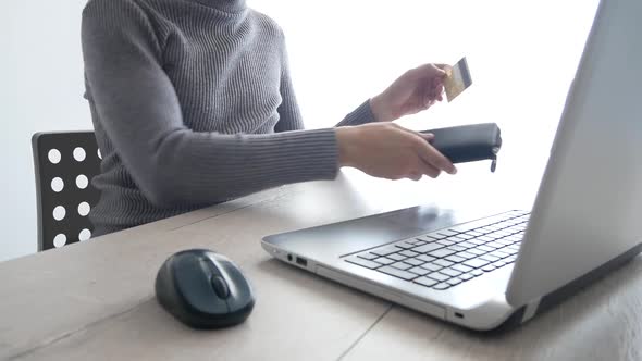 Paying with a Credit-card Online, Shopping. Male Hands with Credit Card During Shopping Through